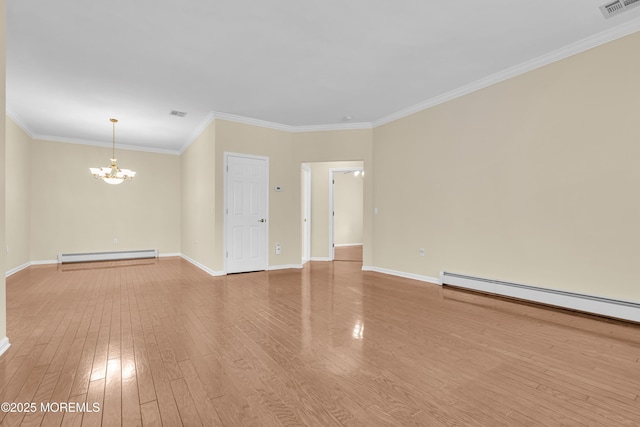 empty room featuring crown molding, a baseboard heating unit, hardwood / wood-style floors, and an inviting chandelier