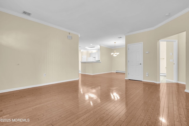 empty room featuring ornamental molding, a baseboard heating unit, an inviting chandelier, and light wood-type flooring