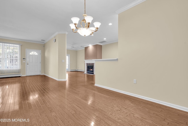 unfurnished living room with crown molding, light hardwood / wood-style floors, and a brick fireplace