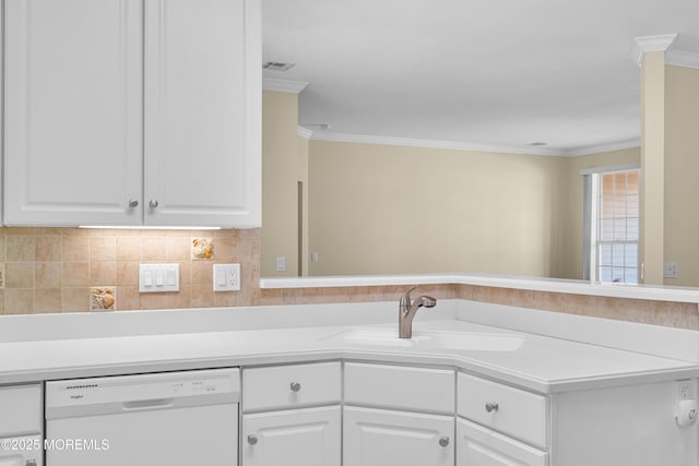 kitchen featuring sink, crown molding, white cabinetry, white dishwasher, and decorative backsplash