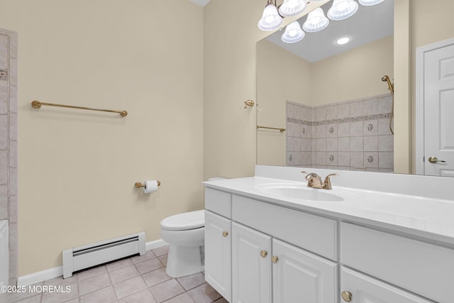 bathroom with baseboard heating, tile patterned floors, toilet, and vanity