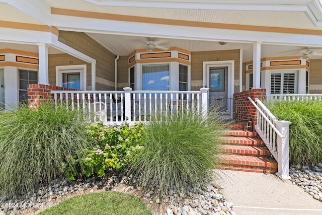 property entrance featuring ceiling fan and covered porch