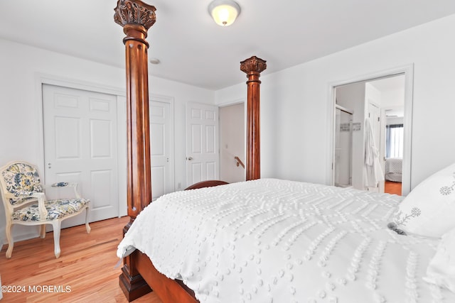 bedroom featuring hardwood / wood-style floors and a closet