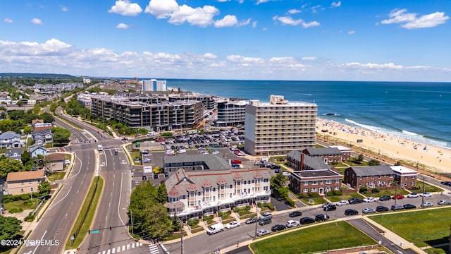 aerial view featuring a water view and a beach view