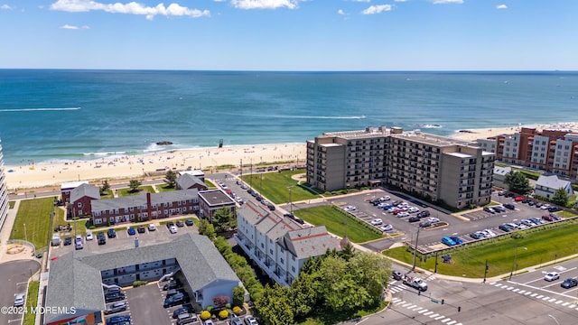 bird's eye view with a view of the beach and a water view