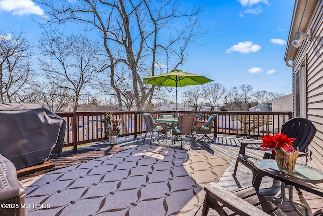 view of patio featuring a wooden deck and grilling area