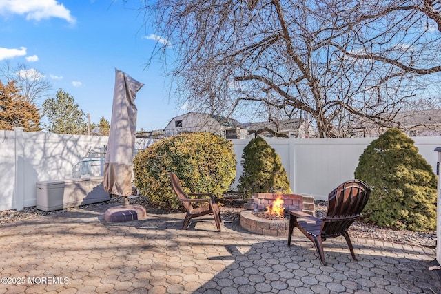 view of patio / terrace with an outdoor fire pit