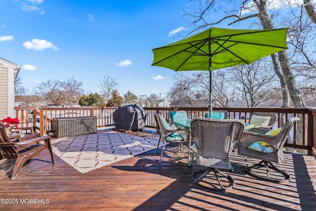 wooden deck featuring area for grilling