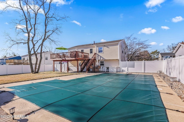 view of swimming pool featuring a deck