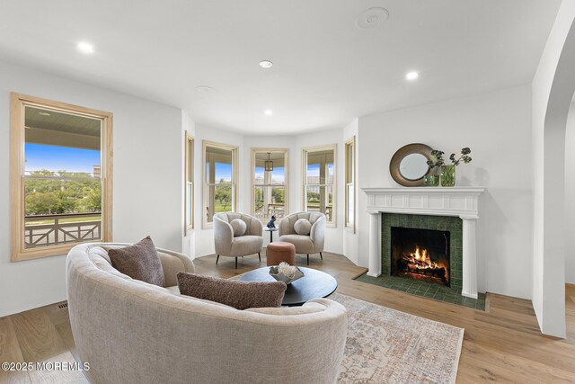 402 Fifth Ave, Asbury Park, NJ 07712 - living room featuring plenty of natural light, a fireplace, wood finished floors, and recessed lighting