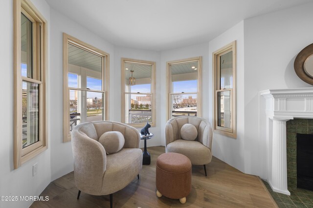 402 Fifth Ave, Asbury Park, NJ 07712 - sitting room with a tile fireplace and dark wood-style flooring