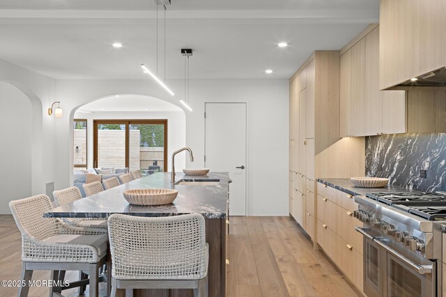 402 Fifth Ave, Asbury Park, NJ 07712 - kitchen featuring a sink, double oven range, modern cabinets, light brown cabinetry, and recessed lighting