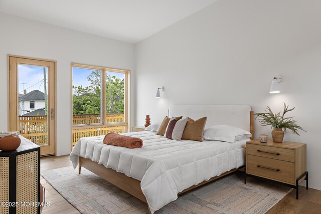 402 Fifth Ave, Asbury Park, NJ 07712 - bedroom featuring access to exterior and light wood-style flooring