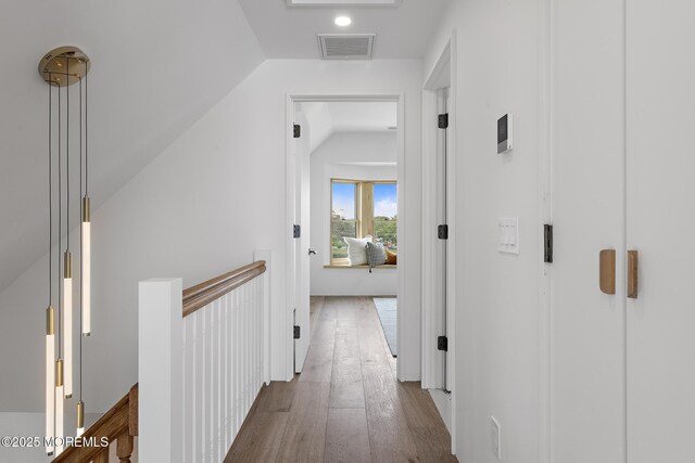 402 Fifth Ave, Asbury Park, NJ 07712 - corridor with an upstairs landing, vaulted ceiling, and wood finished floors
