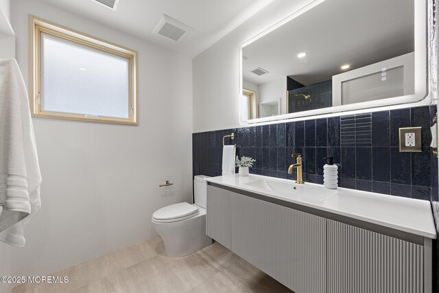 402 Fifth Ave, Asbury Park, NJ 07712 - full bathroom with toilet, vanity, and tile walls