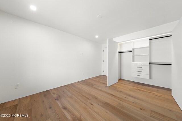 402 Fifth Ave, Asbury Park, NJ 07712 - unfurnished bedroom with light wood-type flooring, recessed lighting, and a closet