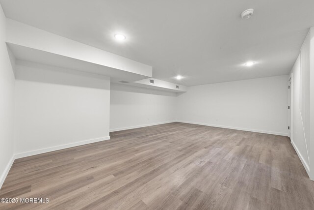 402 Fifth Ave, Asbury Park, NJ 07712 - finished below grade area featuring baseboards, wood finished floors, and recessed lighting
