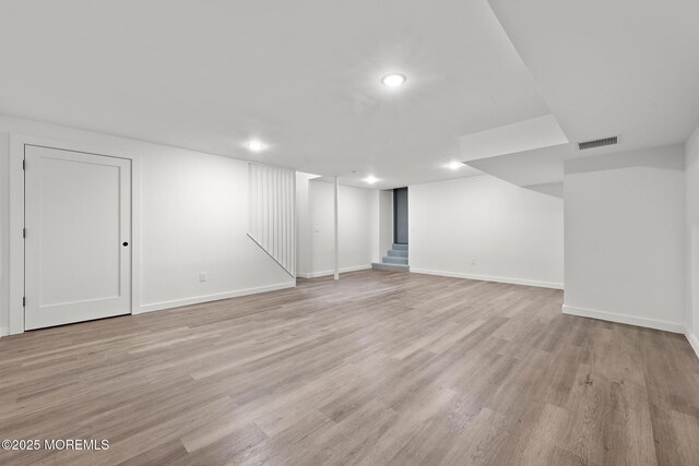 402 Fifth Ave, Asbury Park, NJ 07712 - finished below grade area with light wood-style flooring, baseboards, and recessed lighting