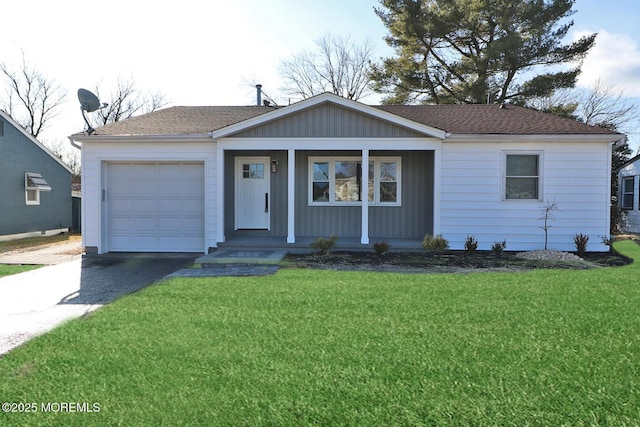 single story home with a garage and a front yard