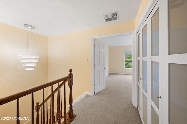 90 Van Liew Ct, East Brunswick, NJ 08816 - hallway featuring an upstairs landing and light carpet