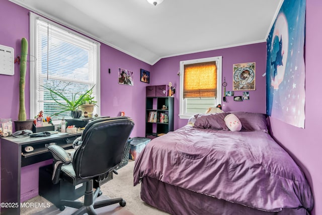 carpeted bedroom featuring vaulted ceiling and ornamental molding