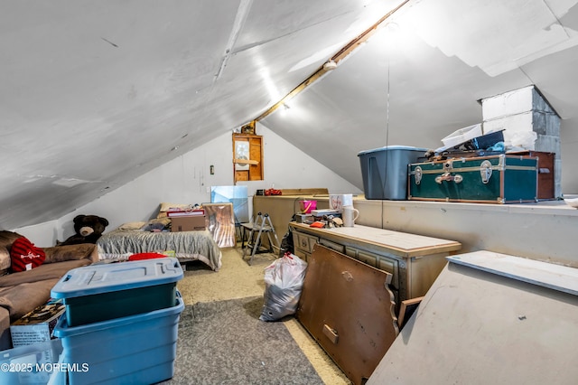 carpeted bedroom with vaulted ceiling