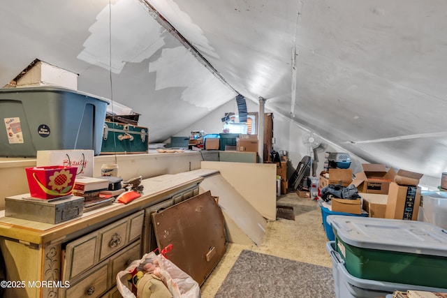 interior space with carpet floors and lofted ceiling