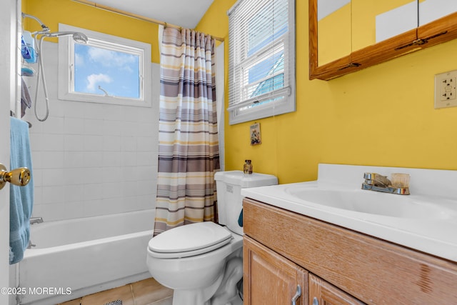 full bath with toilet, plenty of natural light, vanity, and tile patterned floors