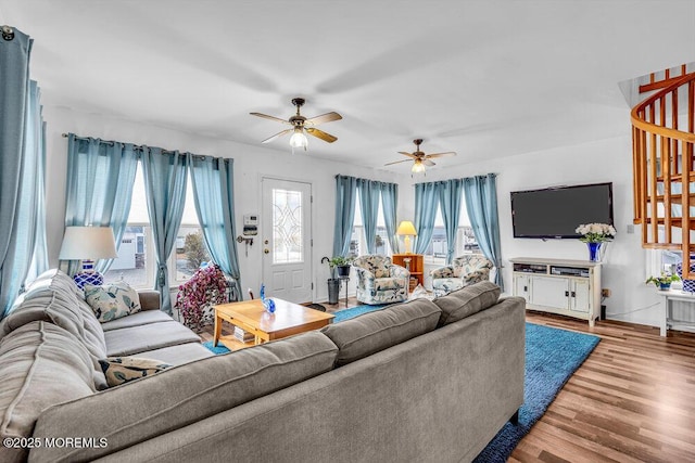 living room with ceiling fan and wood-type flooring