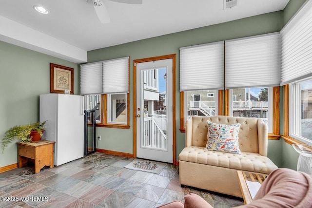 living room with ceiling fan