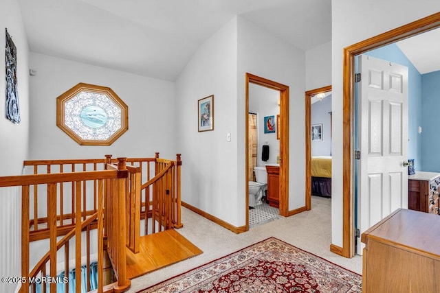 hallway featuring light carpet