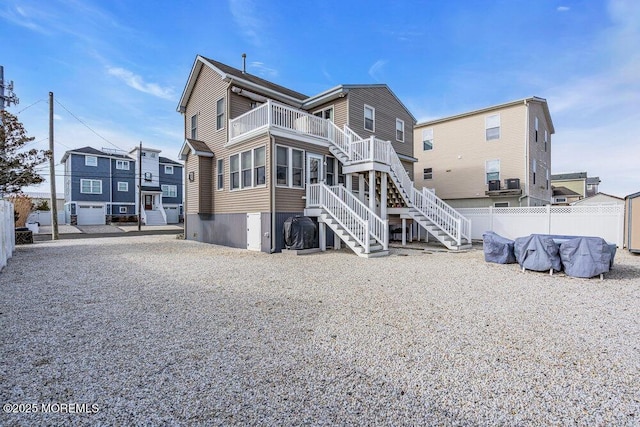 back of property with a balcony