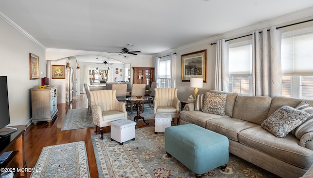 living room featuring ornamental molding, dark hardwood / wood-style floors, and ceiling fan