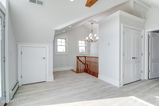 interior space featuring vaulted ceiling, an inviting chandelier, baseboard heating, and light hardwood / wood-style floors