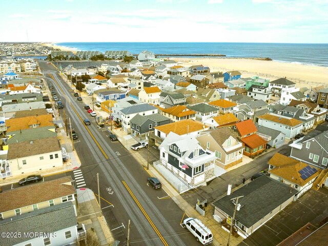 aerial view featuring a view of the beach and a water view