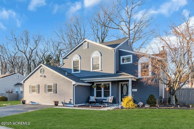 view of front property featuring a porch and a front yard