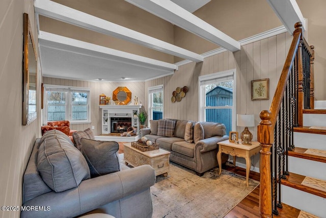 living room with beam ceiling and light wood-type flooring