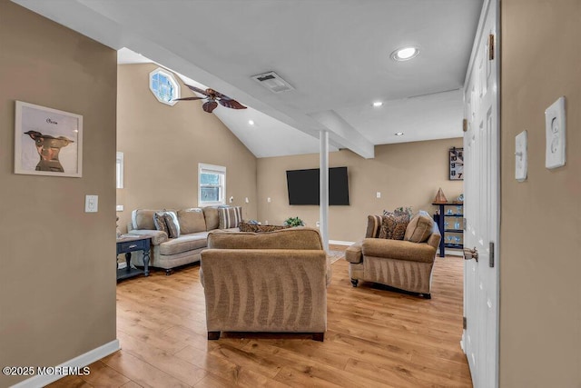 living room featuring ceiling fan, high vaulted ceiling, and light wood-type flooring