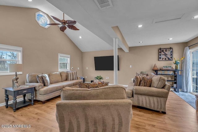 living room featuring ceiling fan, high vaulted ceiling, and light hardwood / wood-style flooring