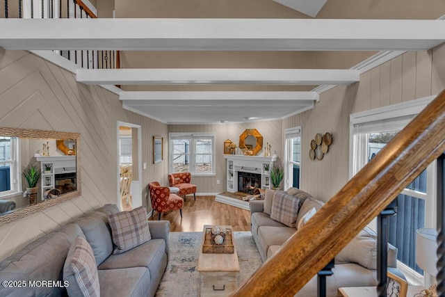 living room with hardwood / wood-style flooring and beam ceiling