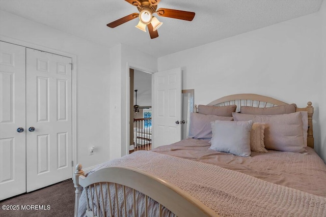 carpeted bedroom featuring a textured ceiling, a closet, and ceiling fan