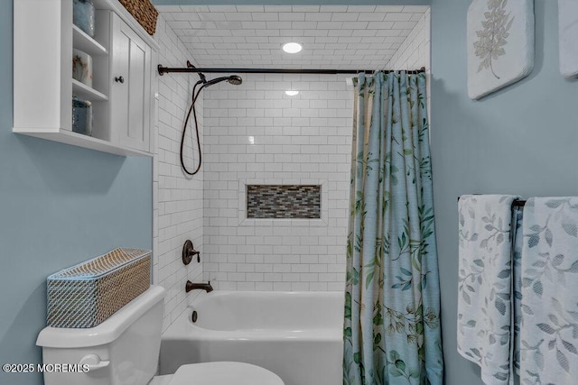 bathroom featuring shower / tub combo and toilet