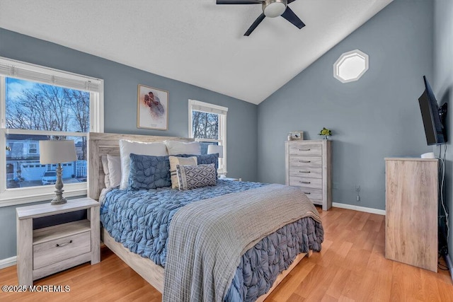 bedroom featuring lofted ceiling, hardwood / wood-style floors, and ceiling fan