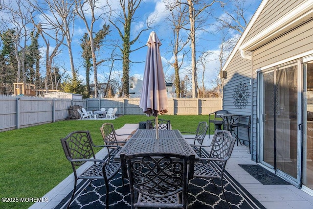 view of patio / terrace featuring a wooden deck and a fire pit