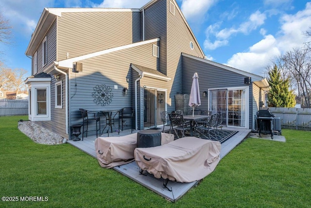 rear view of house with a lawn