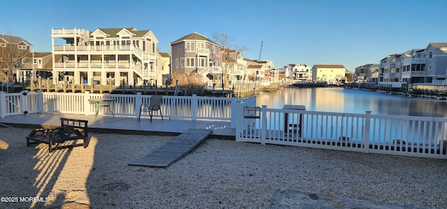 view of dock featuring a deck with water view