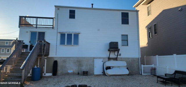 rear view of property featuring a balcony