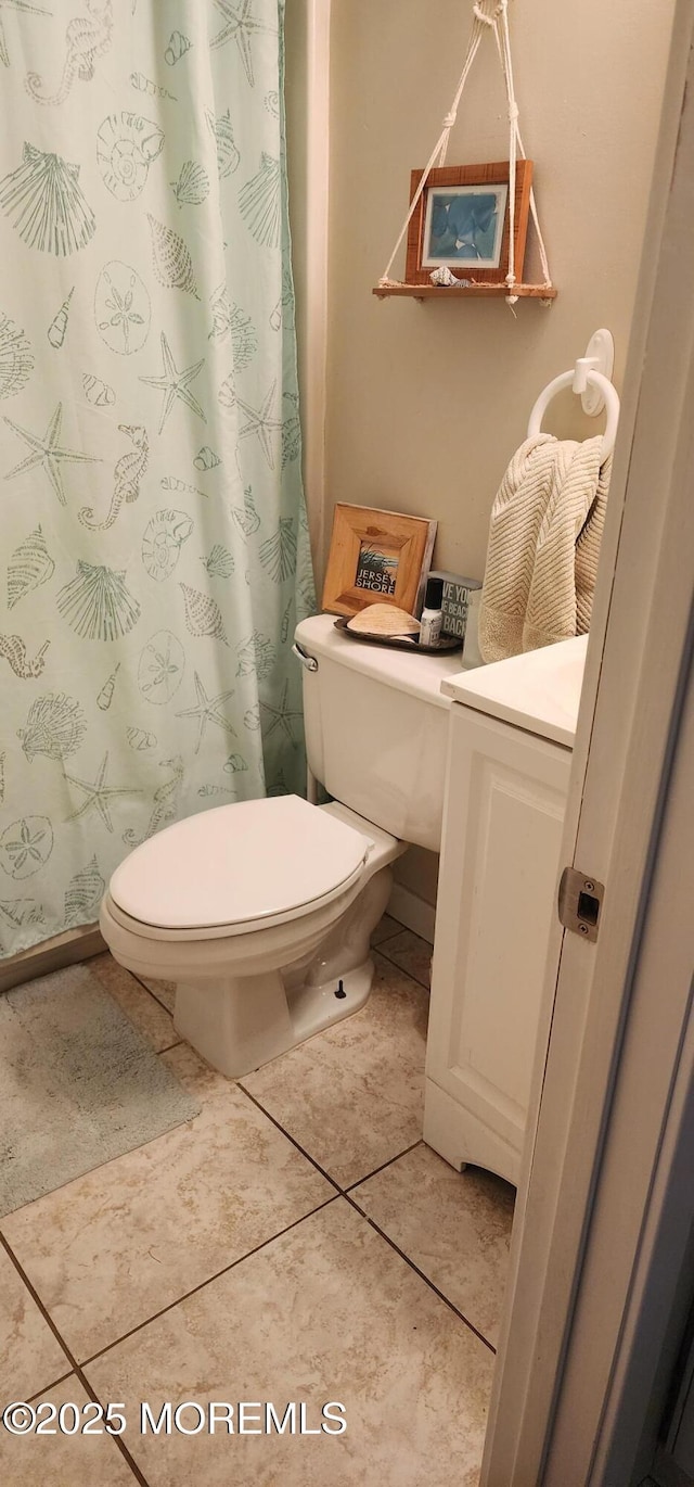 bathroom with tile patterned floors and toilet