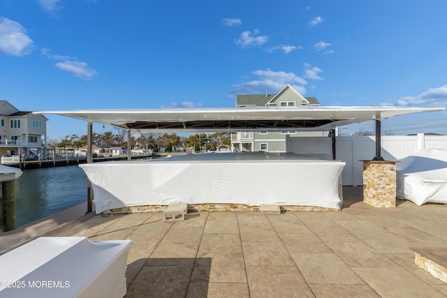 view of patio featuring a water view