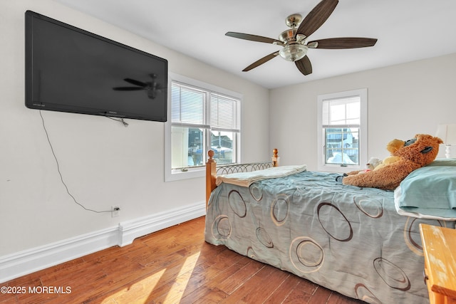 bedroom with hardwood / wood-style flooring and ceiling fan